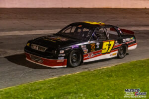 Crown Vic race cars competing on track